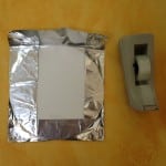 Fold foil over edges of circle and tape to back
